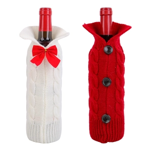 Knitted Christmas wine bottle covers in red and white styles for holiday table decoration