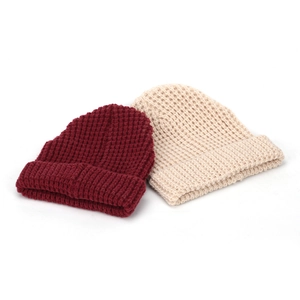 Burgundy and off-white waffle knit beanies for women in a minimalist thermal design