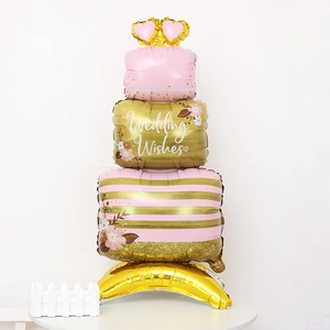 Detailed three-layer cake foil balloon with pink stripes and Wedding Wishes text on table