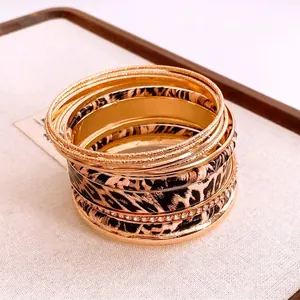 Retro gold multilayer bracelet set featuring leopard print and sparkling rhinestones