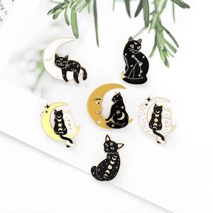 Detailed set of six creative black cat and moon phase enamel pins with gold metal trim