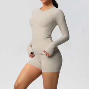 Detail view of skin-friendly brushed yoga set featuring thumbhole cuffs and a slim fit