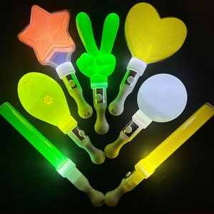 Glow sticks in star and heart shapes with various neon colors against dark background