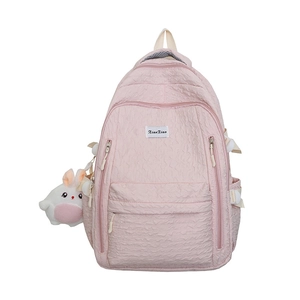 Pink bubble textured backpack with cute white bunny keychain and brand patch details