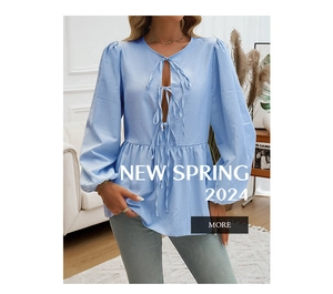 Detail of blue striped lantern sleeves with delicate ribbon tie closure on women's blouse