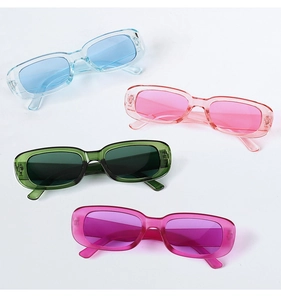 Detailed view of four retro narrow rectangular sunglasses in various translucent colors