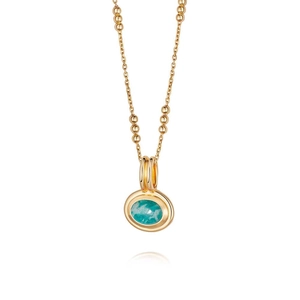 Layered gold chain necklace with turquoise gemstone pendant on white background