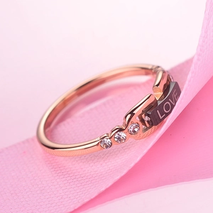 Rose gold titanium steel love ring with black shell inlay and sparkling cubic zirconia
