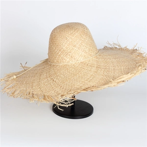 Wide brim raffia sun hat for women with natural frayed edges and minimalist cord detail