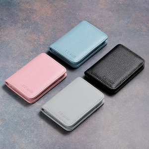 Litchi pattern leather mini wallets in pink blue black and grey on slate background