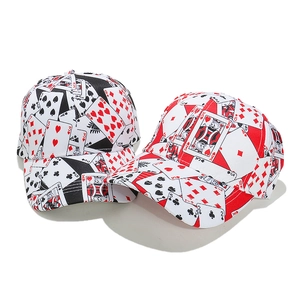Punk style baseball cap with all-over playing card print in red, black and white