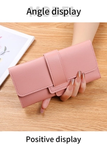 Front view of pink long wallet with litchi texture leather and buckle closure detail