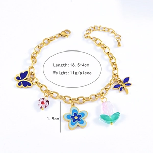 Detailed view of floral bracelet with blue butterfly and tulip charms plus dimensions