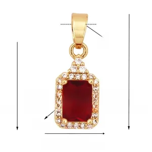 Macro view of gold-plated rectangle pendant with red zircon and white stones
