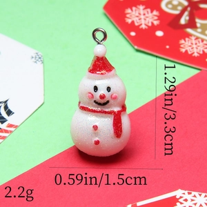 Detailed view of resin snowman charm with red hat and dimensions 1.29in x 0.59in