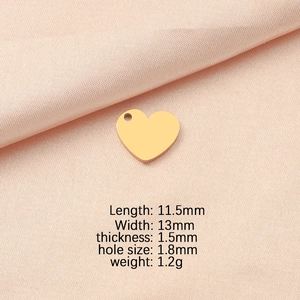 Detail of a 11.5x13mm gold heart pendant charm with precise measurement specifications