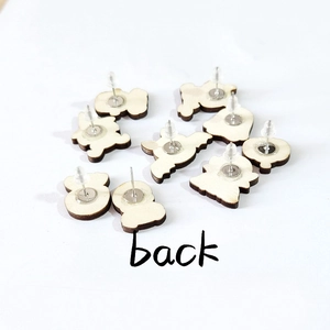 Back view of Halloween wooden stud earrings with metal pins on a white background