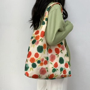 Detail view of the floral canvas tote bag showing large capacity and soft fabric texture