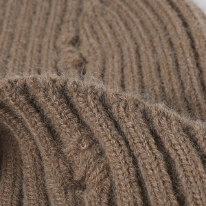 Brown ribbed knit beanie hat for men and women featuring distressed streetwear style