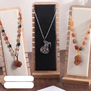 Bamboo wood necklace display stand featuring gemstone pendants and bead jewelry chains