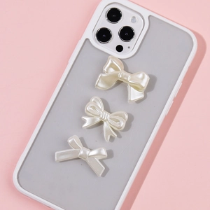 Cute white pearl resin bow phone case with three bows on pink background for DIY style