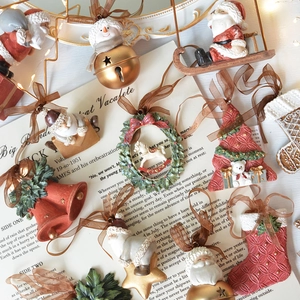 Assorted vintage resin Christmas ornaments with bells and figurines for holiday decor
