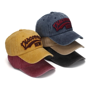 Five assorted colors of vintage washed cotton baseball caps with 3D Discovery embroidery