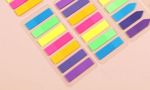 Detailed view of colorful neon arrow and stripe PET index tabs on transparent backing