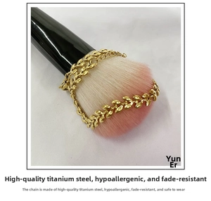Close-up of golden wheat ear bracelet links made of durable titanium steel