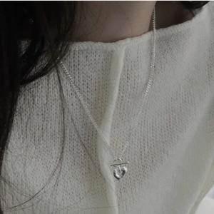 Detailed view of an S925 silver heart pendant necklace with minimalist OT toggle clasp