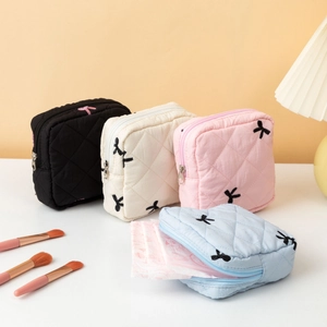Cute quilted bow pouch for sanitary napkins and coins in black, white, pink and blue