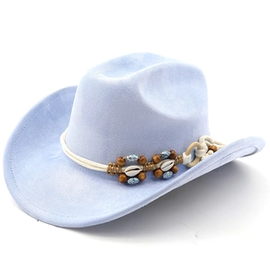 Detail of light blue cowboy hat with ethnic beaded band and shell decorations