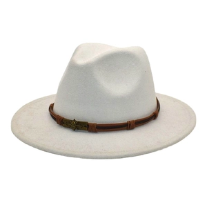 Detail of ivory wool fedora with woven brown band and bronze skull metal ornament