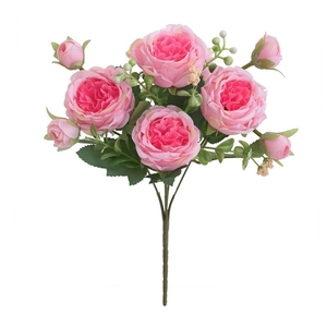 Detailed view of pink artificial rose bouquet with lifelike blooming petals and green leaves
