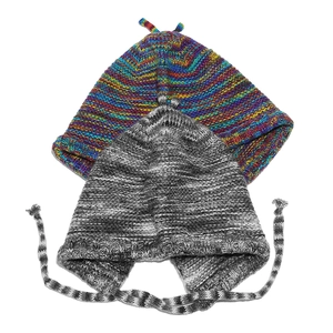 Close-up of rainbow striped beanie and grey knit earflap hat with decorative braided ties