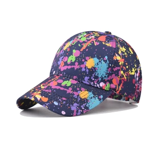 Navy blue baseball cap featuring vibrant colorful graffiti patterns in a 45-degree side view