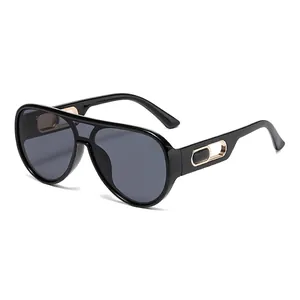 Classic black aviator sunglasses with gold hollow metal temples and dark tinted lenses