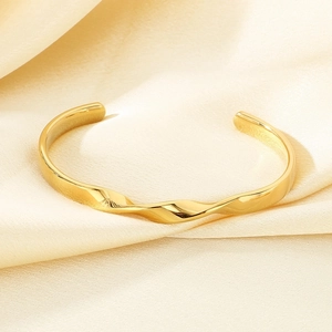 Detail of twisted rope design 18K gold plated stainless steel cuff bracelet