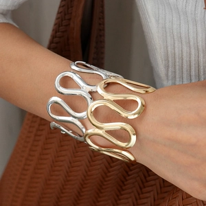 Polished wavy open cuff bracelet in gold and silver finish for women fashion