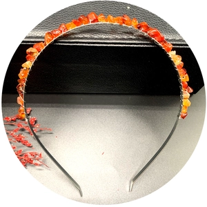 Handmade silver headband with raw red agate crystals on a premium leather jewelry box