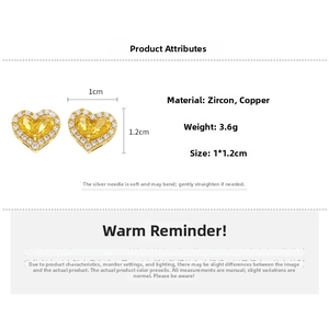 Macro detail of gold plated heart stud earrings showing 1x1.2cm size and 3.6g weight