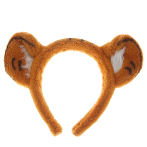 Detail shot of plush tiger ear headband featuring soft orange fabric with black stripes