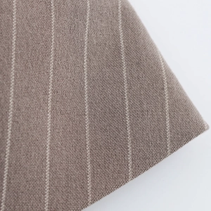 Macro shot of brown striped fabric showing detailed woven texture and white pinstripes