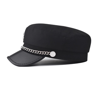 Detail of military cap featuring a silver metal chain and smooth faux leather brim