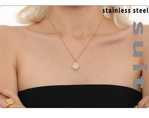 Detail of 18K gold plated stainless steel evil eye pendant necklace and ring set