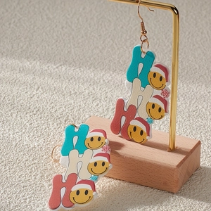 Christmas HO HO HO acrylic drop earrings with yellow smile faces and Santa hats