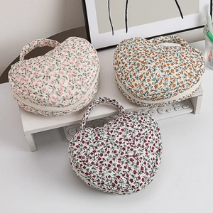 Quilted floral makeup bag with heart pattern and carry handle in three colors