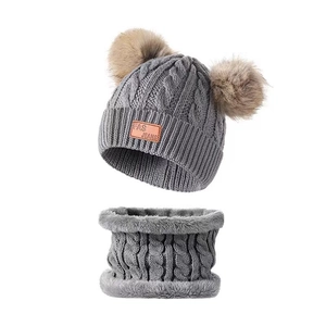 Winter cable knit hat and scarf set in grey featuring double faux fur pom poms and leather tag