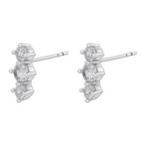 Detailed view of silver stud earrings with three vertically set round cubic zirconia