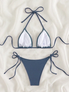 Flat lay of ribbed smoke blue bikini set with adjustable side ties and halter neck detail